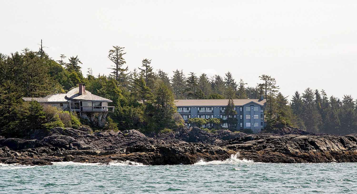 The McDiarmid family cabin seen from sea with the Wick in the background and ocean in foreground